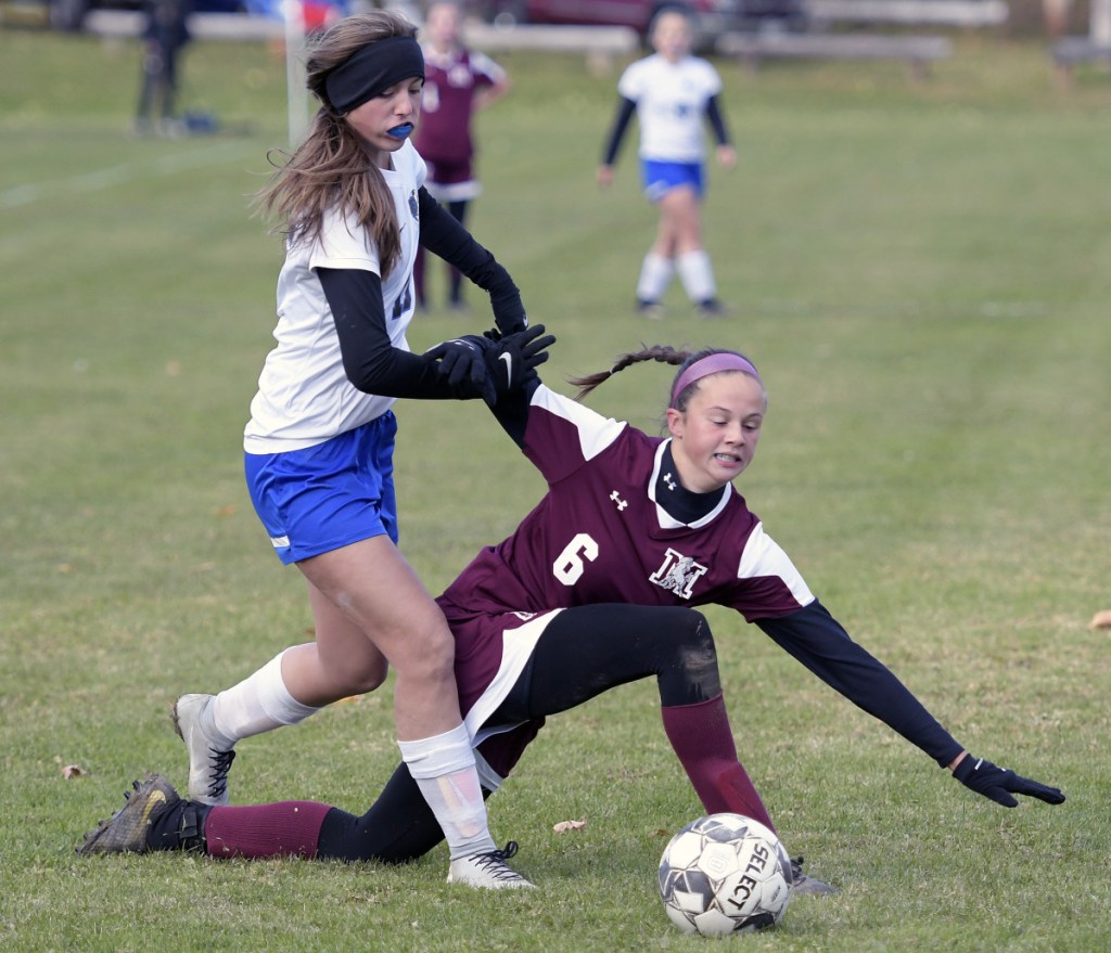 Monmouth's Libby Clement, right, is pushed by Sacopee Valley's Gabbi Black during a Class C South quarterfinal game Thursday in Monmouth.