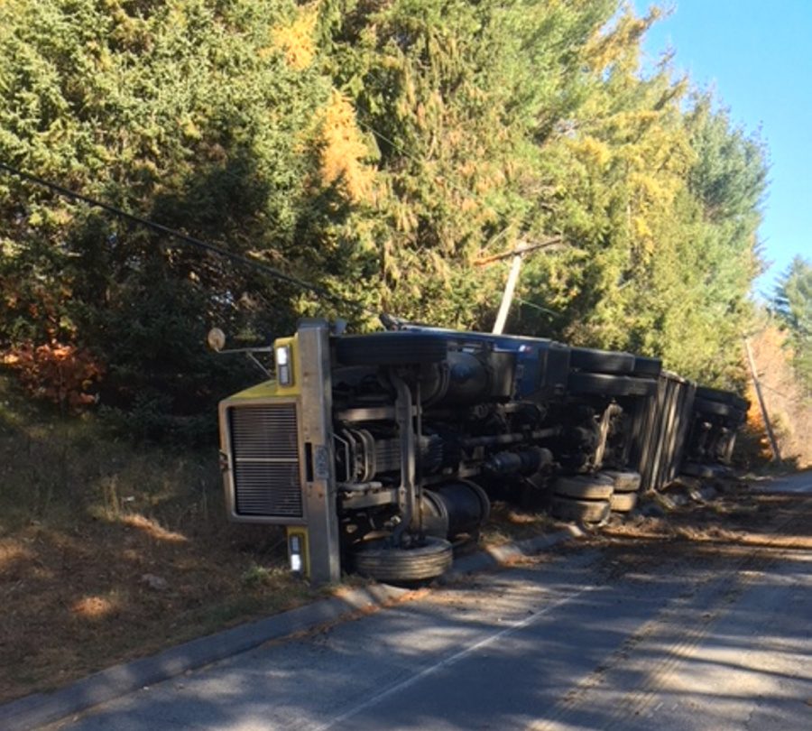 A southbound tractor-trailer went off a curve Friday morning on Route 150 in Athens near downtown and rolled onto its side. No one was injured.