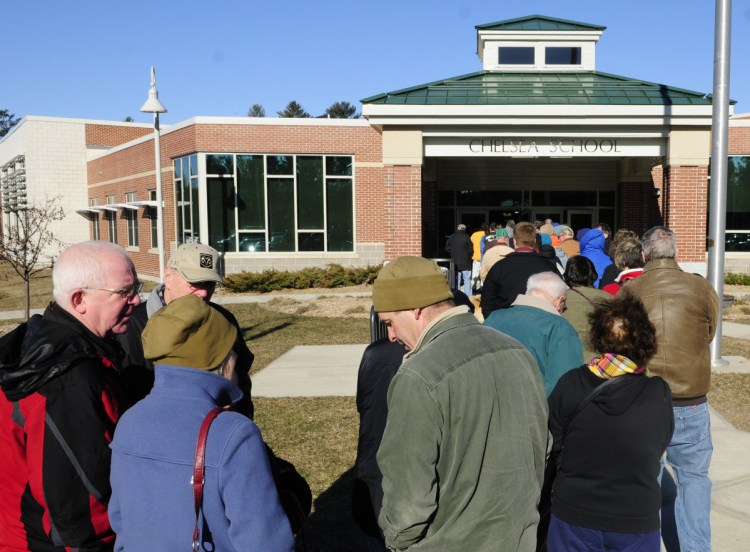 Lines stretched outside to check in and vote during Kennebec County Republican caucus on March 5, 2016, at Chelsea School.