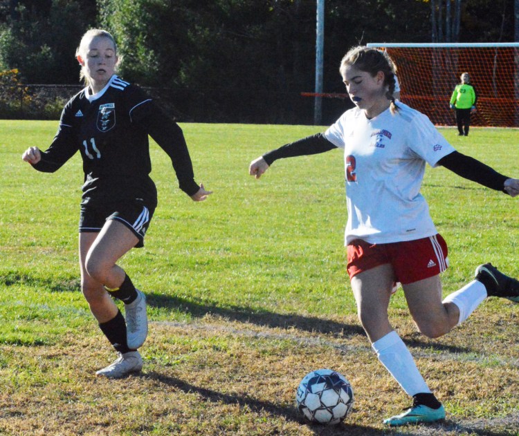 Messalonskee midfielder Natalie Tracy, right, dribbles up the field with Brunswick's Marley Groat in pursuit during last week's Class A North semifinal game in Brunswick.