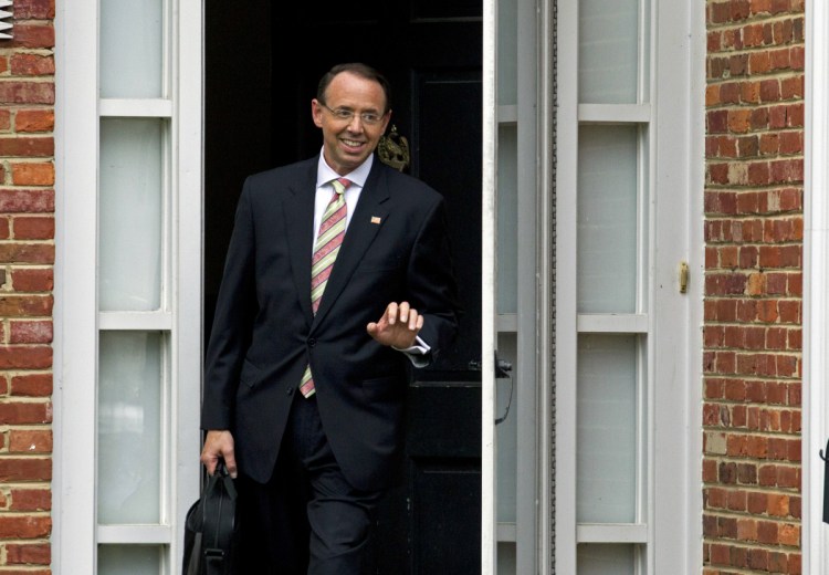 Deputy Attorney General Rod Rosenstein leaves his home on Thursday in Bethesda, Maryland. His meeting with President Trump has been postponed until next week.