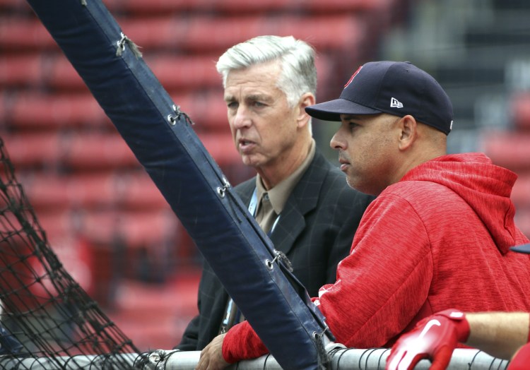 Boston Red Sox President of Baseball Operations Dave Dombrowski, left, and Red Sox Manager Alex Cora watch Thursday's workout at Fenway Park.