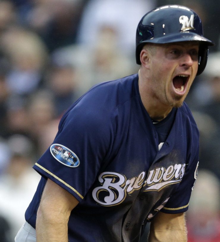 Milwaukee's Erik Kratz celebrates after scoring on a wild pitch in the sixth inning of the Brewers' 6-0 win over the Rockies in Game 3 of the National League Division Series on Sunday in Colorado. The Brewers swept the series to advance to the NLCS.