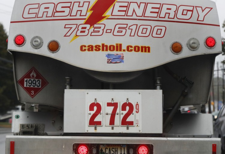 A heating oil delivery truck advertises a price of $2.72 per gallon while making deliveries Thursday in South Portland. Heating oil is getting more costly.