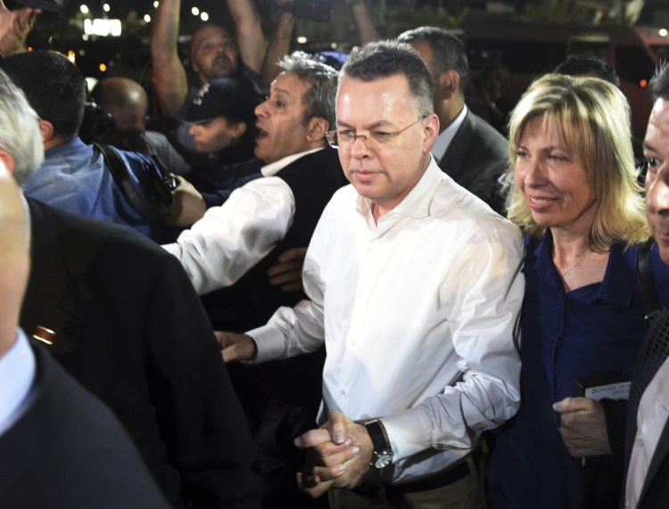 Pastor Andrew Brunson and his wife arrive at Adnan Menderes airport for a flight to Germany after his release following his trial in Turkey.