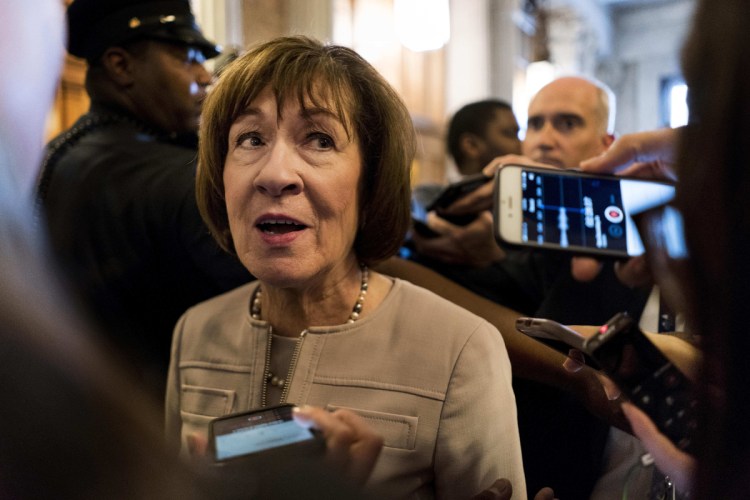 Sen. Susan Collins talks to journalists after speaking in favor of Brett Kavanaugh on Oct. 5. The jury is still out on which party, if either, the Kavanaugh fight will help in midterms in Maine.