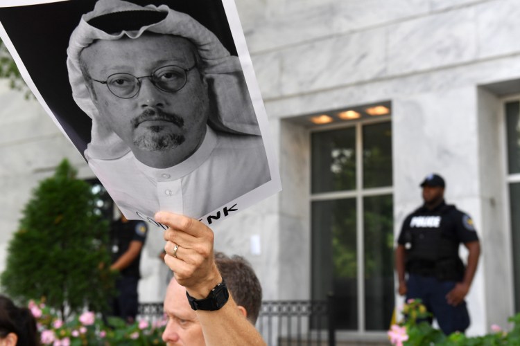 Michael Beer holds a poster during a rally about the disappearance of Washington Post journalist Jamal Khashoggi outside the Embassy of Saudi Arabia in Washington on Wednesday.