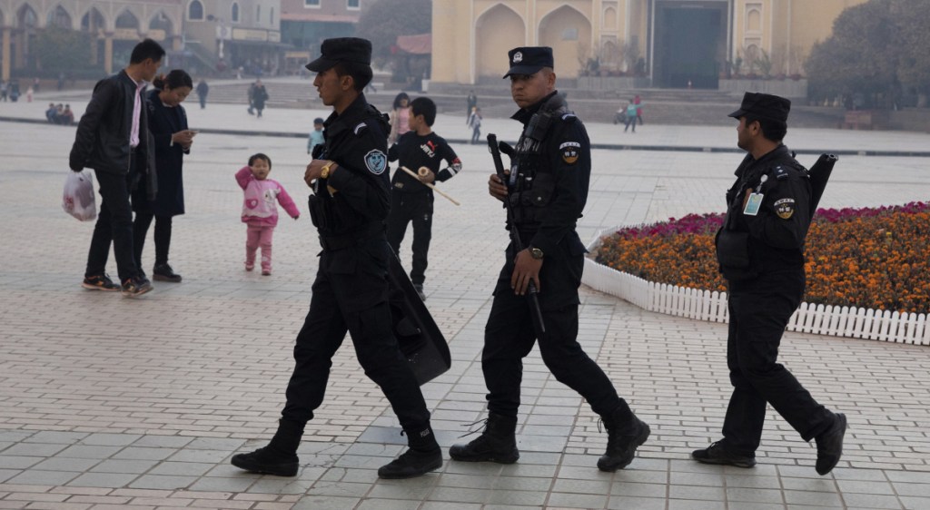 Security personnel patrol in western China's Xinjiang region last year as the national government pushes a policy that targets Muslim minorities.