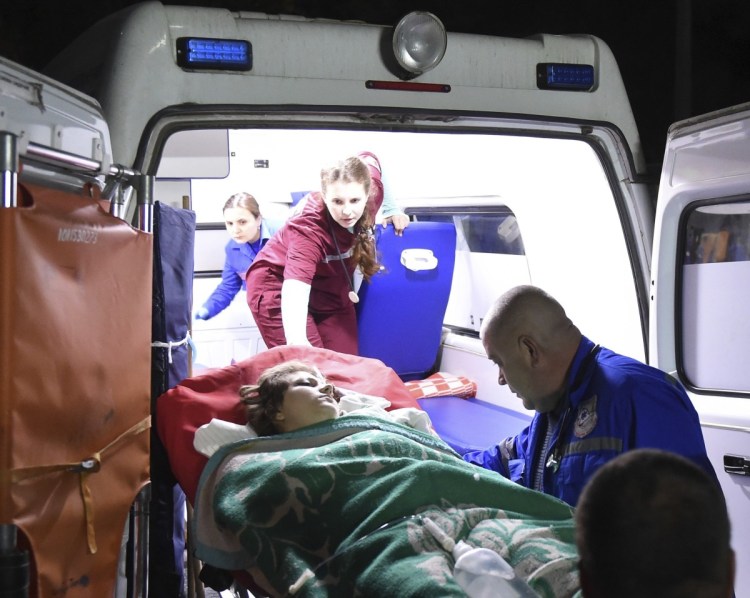 Medics load an injured person onto an ambulance in Kerch, Crimea, on Wednesday. 