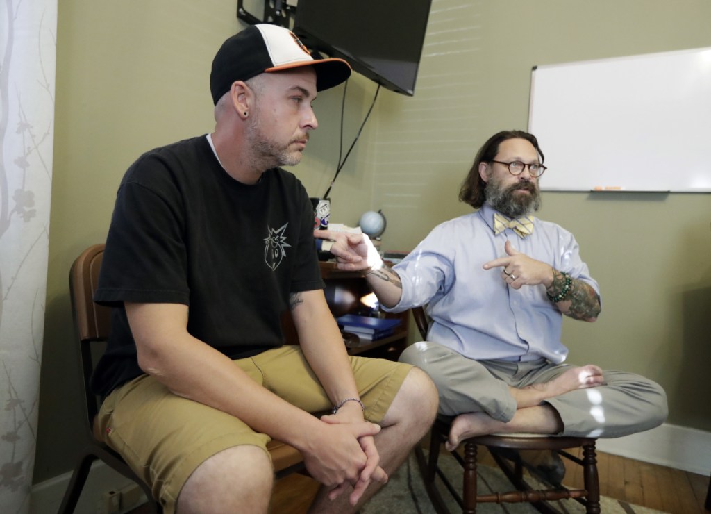 Tim Nolen, left, participates in a relapse prevention group session with counselor Bob Benson, right, at a treatment facility run by Buffalo Valley Inc. in Nashville, Tenn. Nolen has no health insurance coverage and his treatment for opioid addiction is funded by a grant program Congress approved in 2016 under the 21st Century Cures Act.