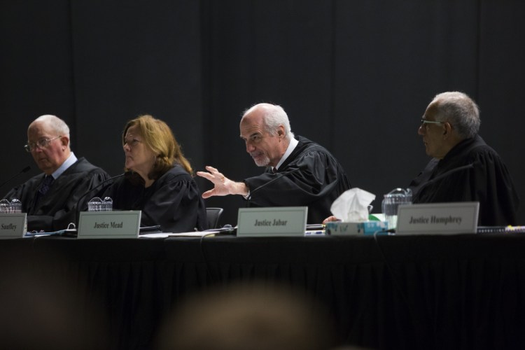 Justices of the Maine Supreme Judicial Court hear oral arguments in the landlord's appeal Thursday at Wells High School as part of the court's annual session before students.