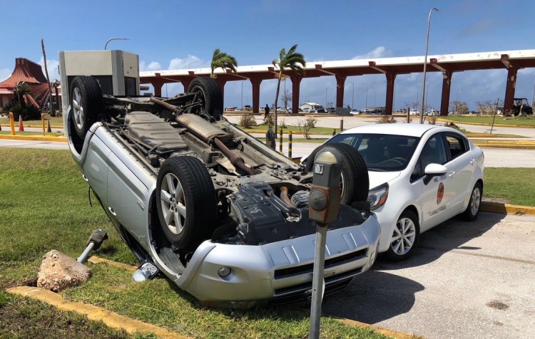 An overturned car is shown at the airport after Super Typhoon Yutu hit the U.S. Commonwealth of the Northern Mariana Islands in Garapan, Saipan.