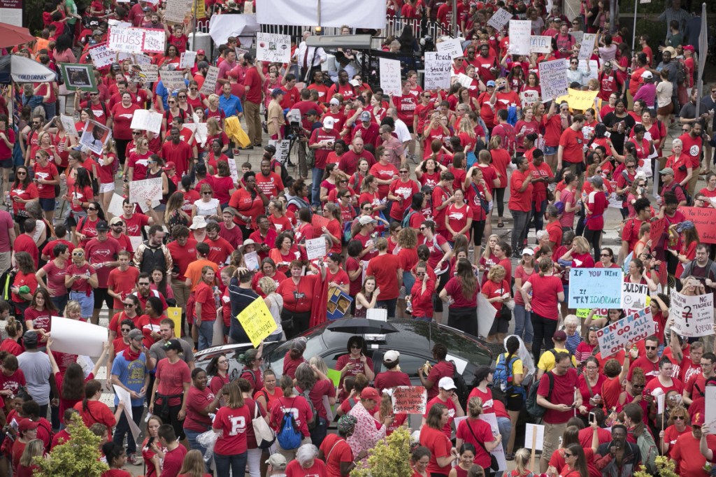 Thousands of North Carolina teachers descend upon the Legislature to lobby for better pay and education funding on May 16 in Raleigh, N.C.