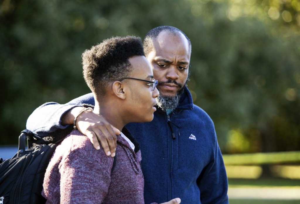 Gavriel Fulcher-Daniels, left, and Stephen Daniels talk with members of the media after a deadly shooting at Butler High School in Matthews, N.C., Monday. "It sounded like a balloon but louder," Fulcher-Daniels said, after hearing a gunshot.