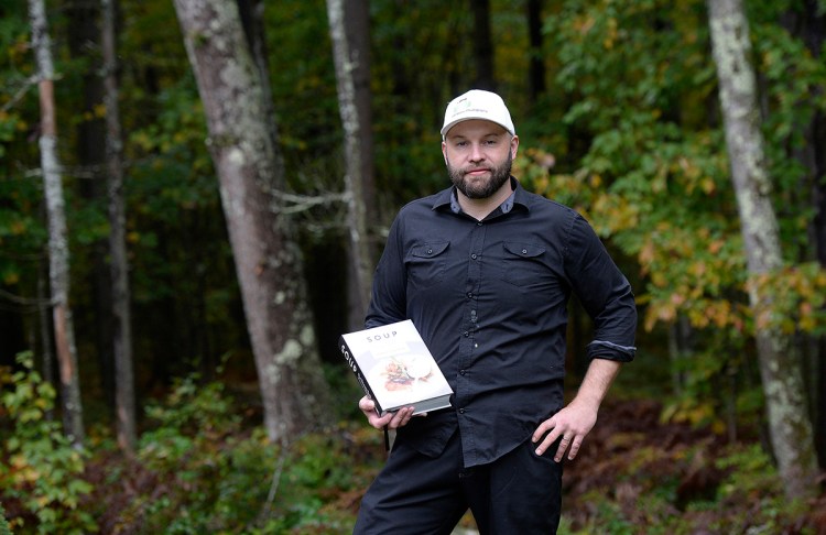 Derek Bissonnette of DB Maine photography holds his book Soup Tuesday, October 2, 2018. 