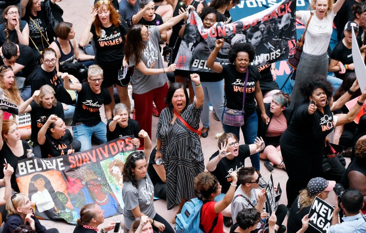 Protesters opposed to Supreme Court nominee Brett Kavanaugh take over the atrium of the Hart Senate Office Building in Washington, D.C., on Thursday, after senators received the new FBI report on sexual-assault allegations against him. 