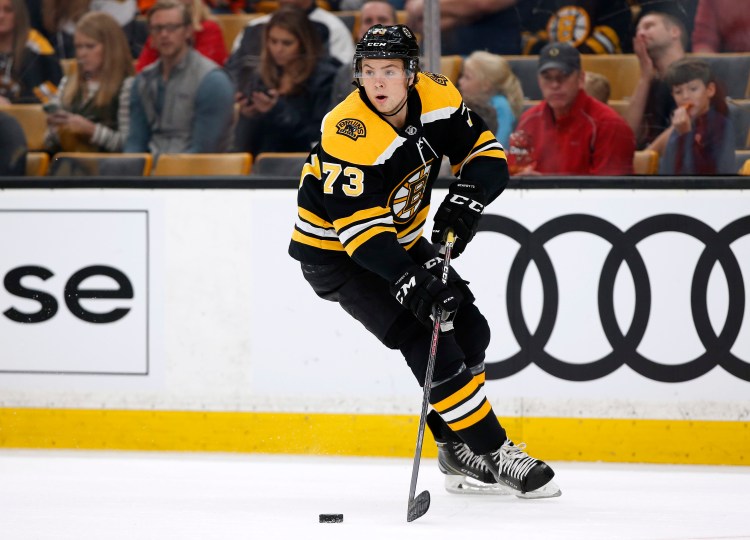 The Boston Bruins played without multiple defense on Saturday night, including Charlie McAvoy, who was sent home because he wasn't feeling well. 