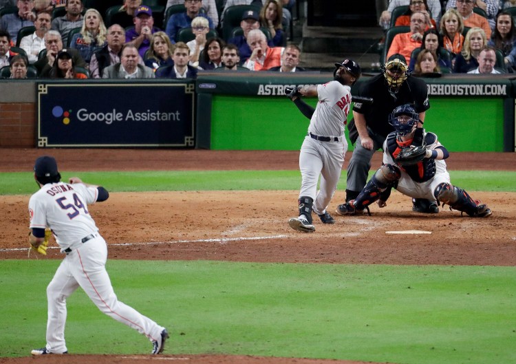 Boston's Jackie Bradley Jr. connects for a grand slam off Houston Astros relief pitcher Roberto Osuna in the eighth inning, breaking open Game 3 the American League Championship Series.