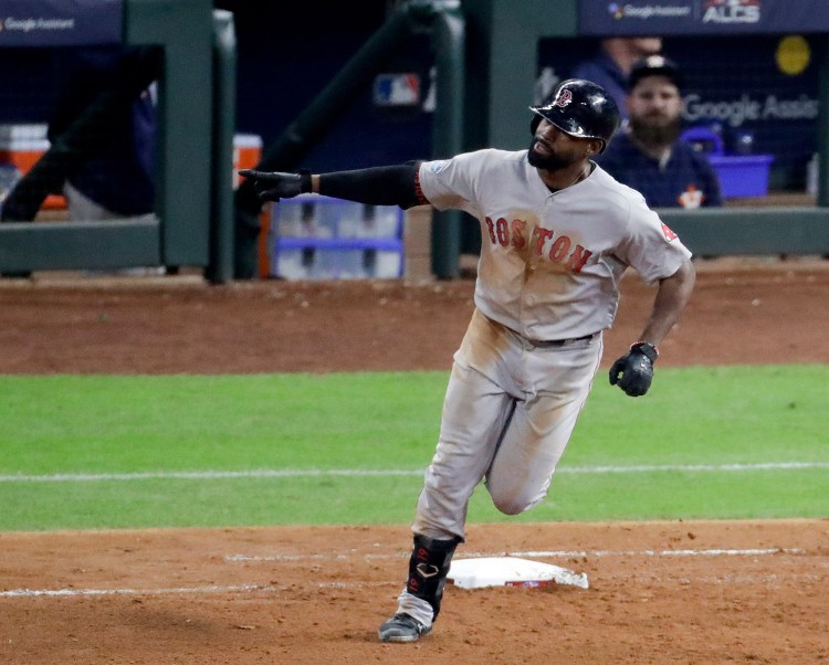 Boston Red Sox's Jackie Bradley Jr., celebrates his two-run home run in the sixth inning of Game 4 of the American League Championship Series on Wednesday night in Houston.