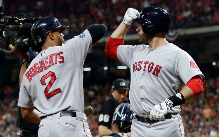 J.D. Martinez, right, and Xander Bogaerts are part of a high-powered Boston Red Sox offense, which leads the team into the World Series against the Los Angeles Dodgers. 