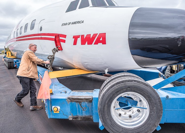 Marty Batura, from Worldwide Aircraft Recovery, checks the rigging on the body of the TWA aircraft, which is being moved to JFK airport to join the TWA Hotel complex as a cocktail bar.  