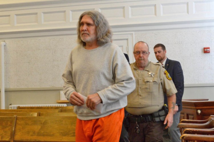 James "Ted" Sweeney, 58, formerly of Jay, enters Franklin County Superior Court on Thursday in Farmington, followed by jail transport officer Cpl. Phillip Richards and court officer Cpl. John Irving. Sweeney pleaded not criminally responsible by reason of insanity in the bludgeoning death of his girlfriend in Jay last year.