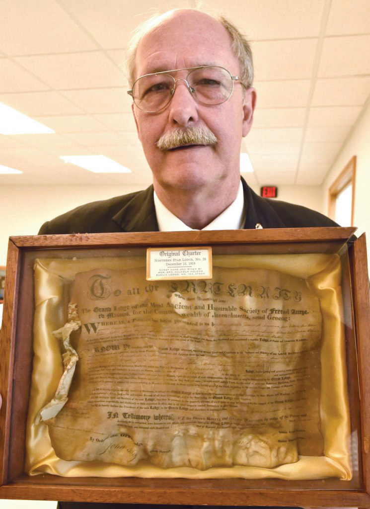 Daniel Crowley, the worshipful master at the Northern Star Lodge 28 in North Anson holds the original 200-year-old charter signed by Paul Revere on Thursday. The Masonic Hall will celebrate with a barbecue, music, vendors and entertainment this Saturday.