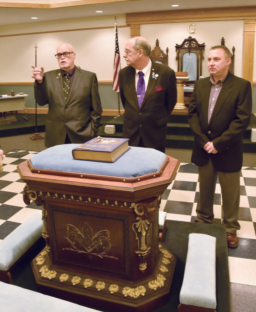 Masons of Northern Star Lodge 28 in North Anson on Thursday, October 4, 2018, speak near the altar in the lodge hall about the 200th celebration this Saturday. From left are Ken Ingalls, Dan Crowley and  Brian Nelson. The Masonic Hall will celebrate with a bbq, music, vendors and entertainment.