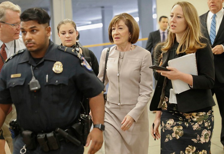 Sen. Susan Collins, R-Maine, is followed by members of the media as she walks to the Capitol before a vote to advance Brett Kavanaugh's nomination to the Supreme Court, on Capitol Hill, Friday, Oct. 5, 2018 in Washington. 