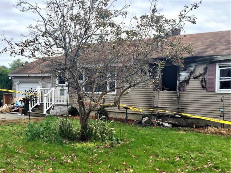 An 83-year-old woman died in a fire at this Saco home Saturday, officials say. (Staff photo by Liz Gotthelf)