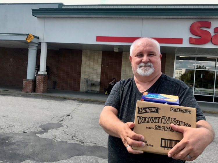 Dennis Mills, 63, of Waterville, pictured outside Save-A-Lot on Aug. 15, said he supports a proposed ordinance that would ban plastic shopping bags at large retailers.