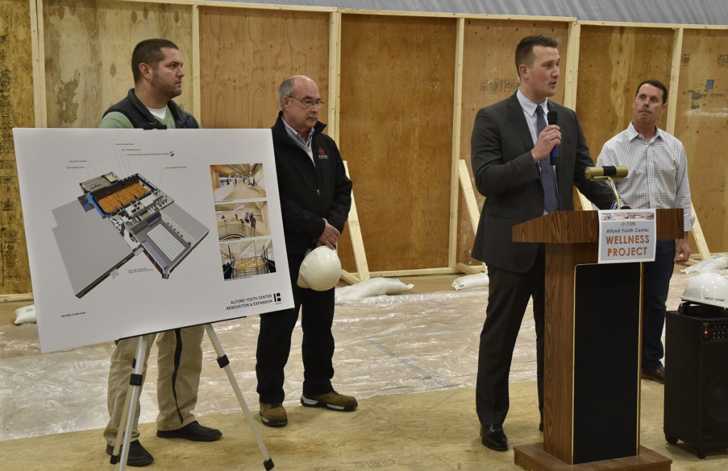 From left, Steve McCarron and Mitch Sammons, of Fairfield-based Sheridan Construction; John Ellis, of Harriman in Portland, and project manager Brent Burger describe the $6.12 million Alfond Youth Center Wellness project and its expected progress at a groundbreaking ceremony Thursday in Waterville.