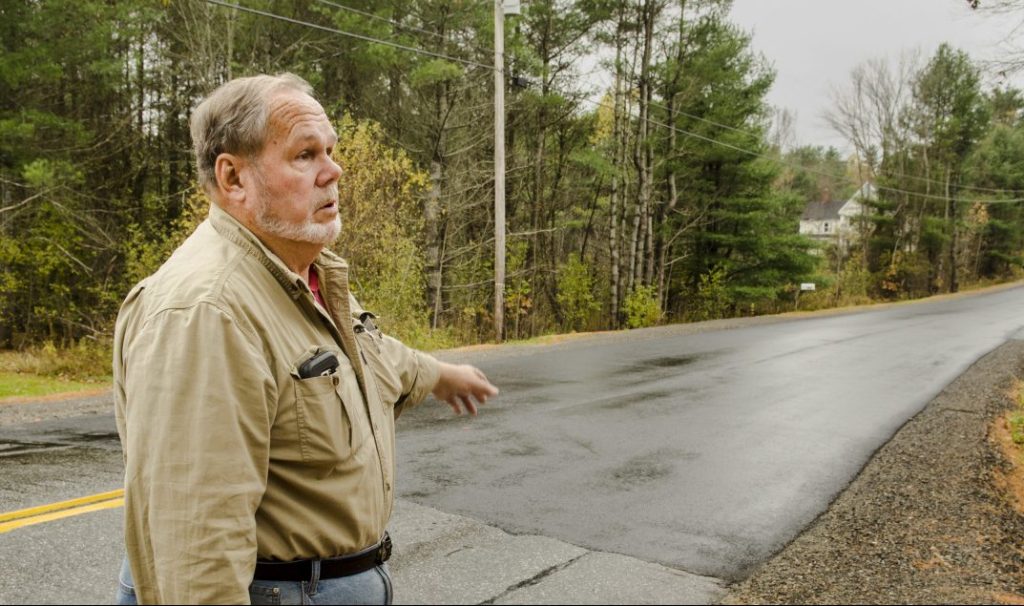 Farmingdale Road Commissioner Steve Stratton talks on Thursday about the pavement level on a recently repaired section of Northern Avenue in Farmingdale.