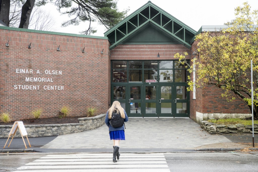 A student walks to the Einar A. Olsen Student Memorial Student Center building Friday at the University of Maine at Farmington.