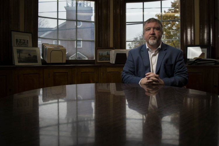 Eric Brown, interim president of the University of Maine at Farmington, sits in his office Friday in Farmington.