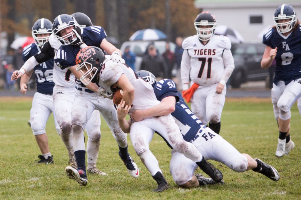 GF3 - Gardiner's Nate Malinowski is tackled by Fryeburg's Reese Kneissler in a Class C South semifinal game Saturday at Fryeburg Acedemy.