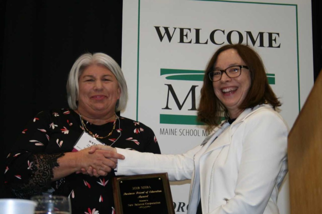 Katherine Foy Bartley, left, receives the Maine School Boards Association Business Friend of Education Award on Oct. 25 in Augusta from MSBA President Maureen King.