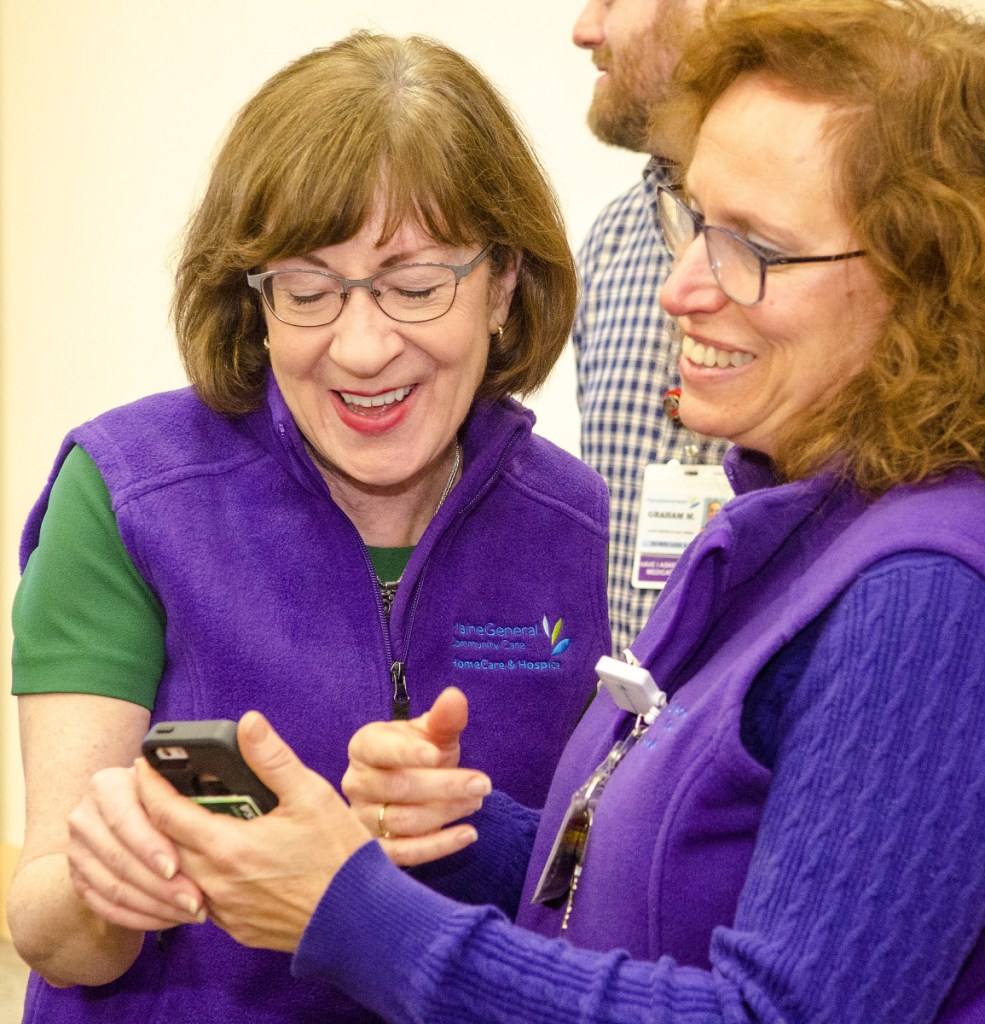 U.S. Sen. Susan Collins, R-Maine, left, chats with Gina Mosca on Wednesday after speaking to home care and hospice workers at MaineGeneral Medical Center's Alfond Center for Health in Augusta.