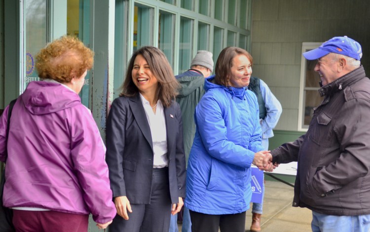 Kennebec and Somerset County District Attorney Maeghan Maloney, second from left, and Sen. Shenna Bellows, D-Manchester, greet voters around 8:50 am. Tuesday at the Boys and Girls Clubs of Kennebec Valley in Gardiner.