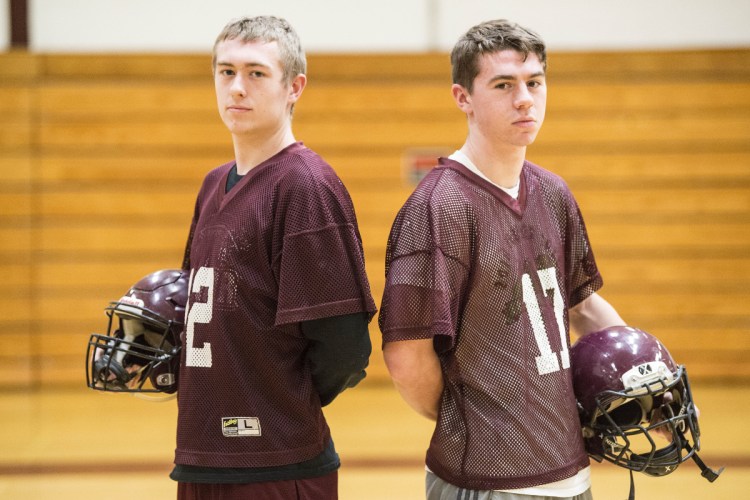 Brock Graves, left, and his cousin Chance Graves pose inside Nokomis Regional High School in Newport on Tuesday afternoon.