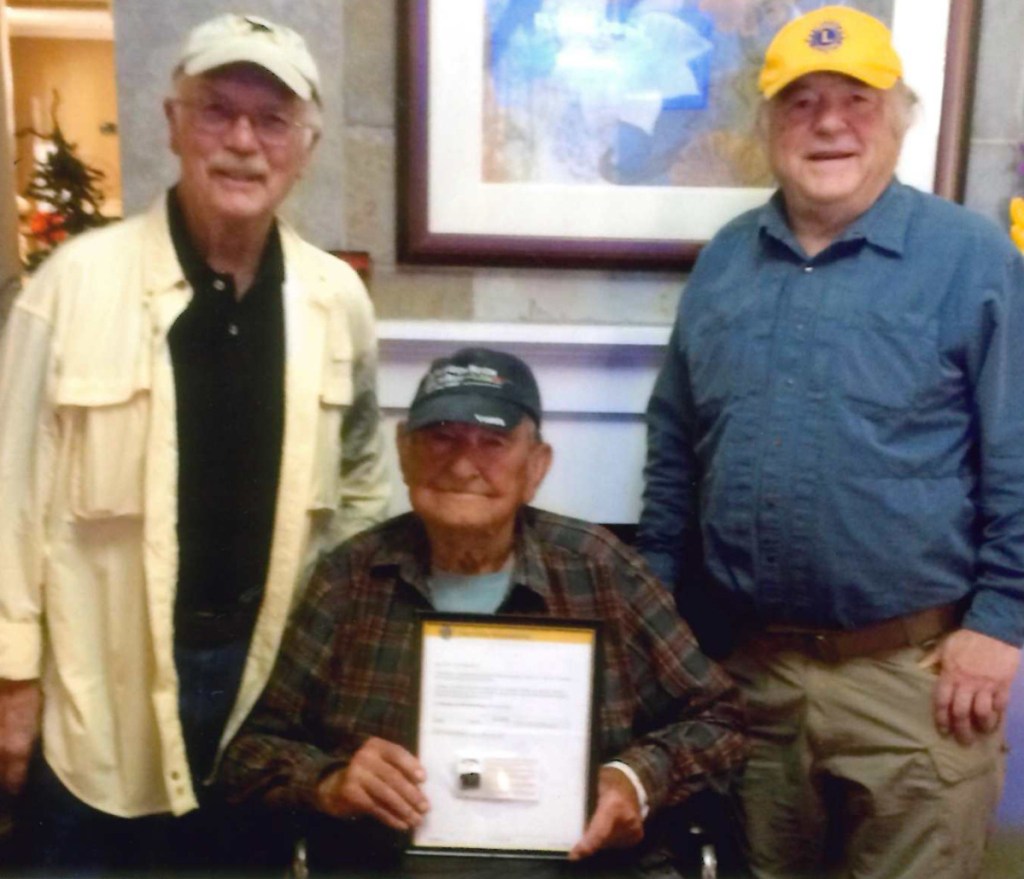 Monmouth Lions Club members from left are Aaron Paradis, his grandfather James Paradis and Guy Piper. James Paradis was presented the Lions Club International Silver Centennial Membership Award on Oct. 10.