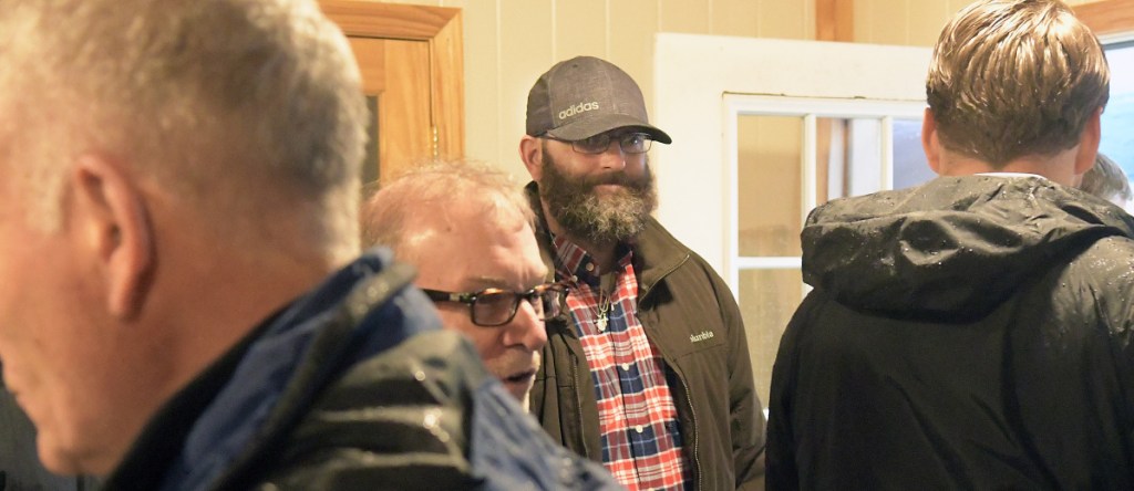 James Marcoux, center, attends the groundbreaking Tuesday for the Bread of Life Shelter expansion in Augusta. The Marine Corps veteran stayed at the shelter while rebuilding his life and currently helps collect food for the entity.