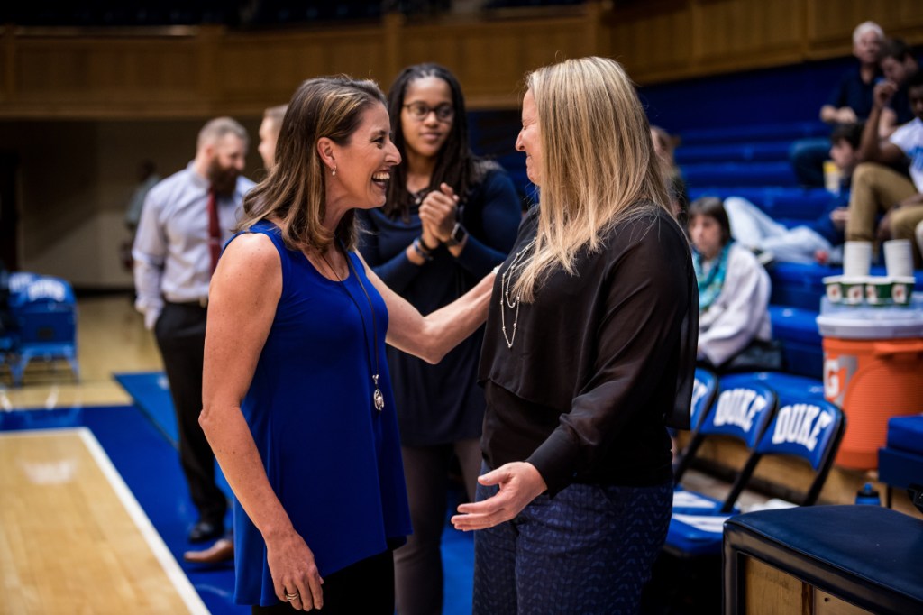 Duke women's basketball coach Joanne McCallie talks with Maine coach Amy Vachon prior to a game last season in Durham, North Carolina.