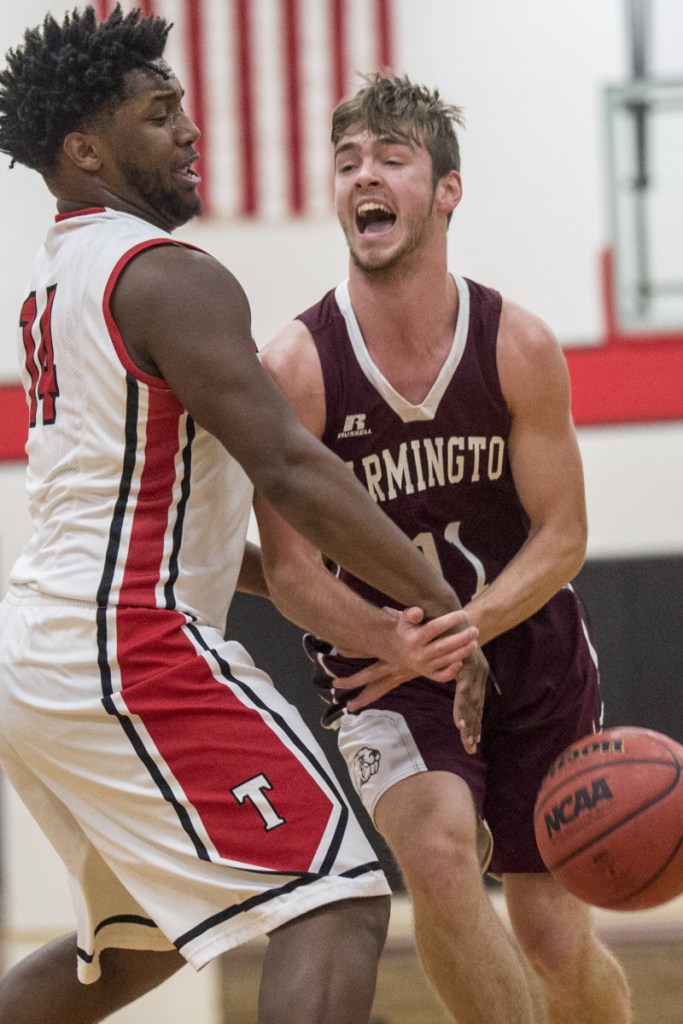 Thomas College's Justin Butler, left, strips the ball from University of Maine at Farmington's Isaac Witham (11) during a game last season at Thomas College in Waterville.