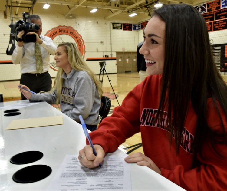 Skowhegan field hockey players Lizzie York, left, and Maliea Kelso were the center of attention while signing letters of intent for Division I colleges Wednesday in Skowhegan.