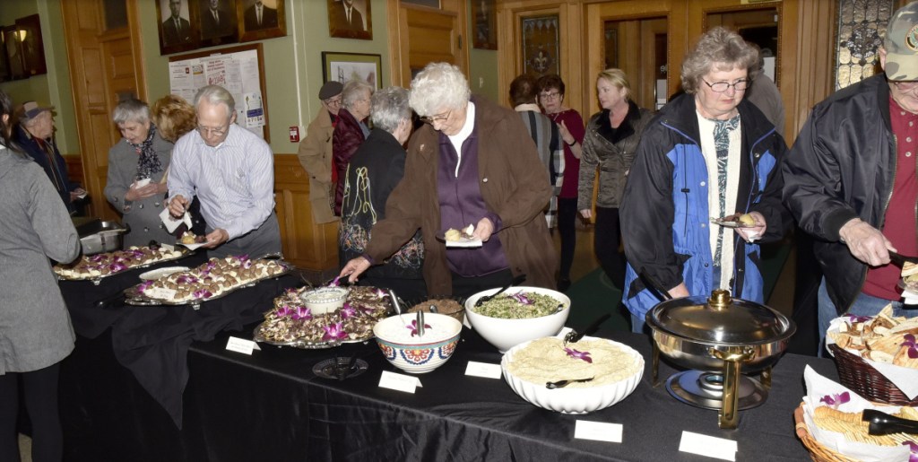 Plenty of Lebanese food was available for fans of local author Earl Smith during a reception Thursday in the Waterville City Hall lobby. Waterville's diversity and its immigrant population were topics of Smith's new book and his presentation Thursday.