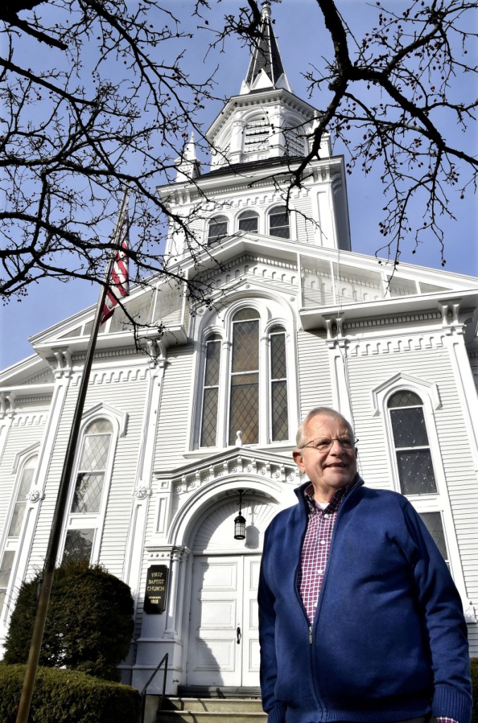 Writer Earl Smith stands before the First Baptist Church, Waterville's oldest standing public building, on Thursday. Smith's "Waterville Village, The Story of Waterville, Maine," is the second comprehensive history of the city of Waterville. The Rev. Edward Carey Whittemore, a pastor of the First Baptist Church who was among those at the dedication of the Opera House 116 years ago, compiled the first history of Waterville.