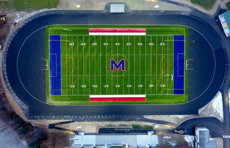 The new Messalonskee High School field for football, soccer and lacrosse, track and bleachers — seen Nov. 15 in an aerial view from a drone on Thursday — is lit up with new lights at the Oakland school.