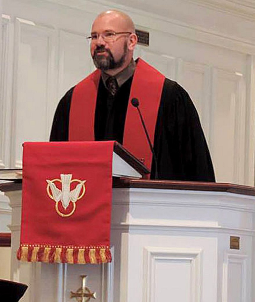 The Rev. Mark Wilson conducts a service at the First Congregational Church in Waterville.