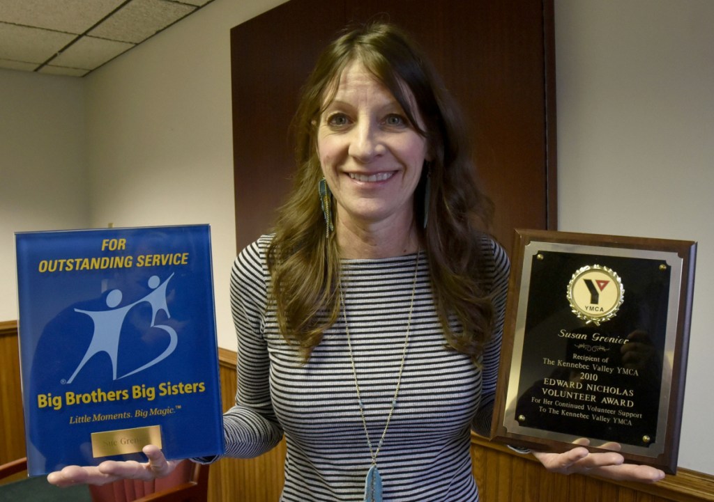 Sue Grenier is well know for her volunteer work and community involvement as illustrated with two plaques for volunteerism from Big Brothers Big Sisters and Kennebec Valley YMCA organizations. (Staff Photo by David Leaming/Staff Photographer)